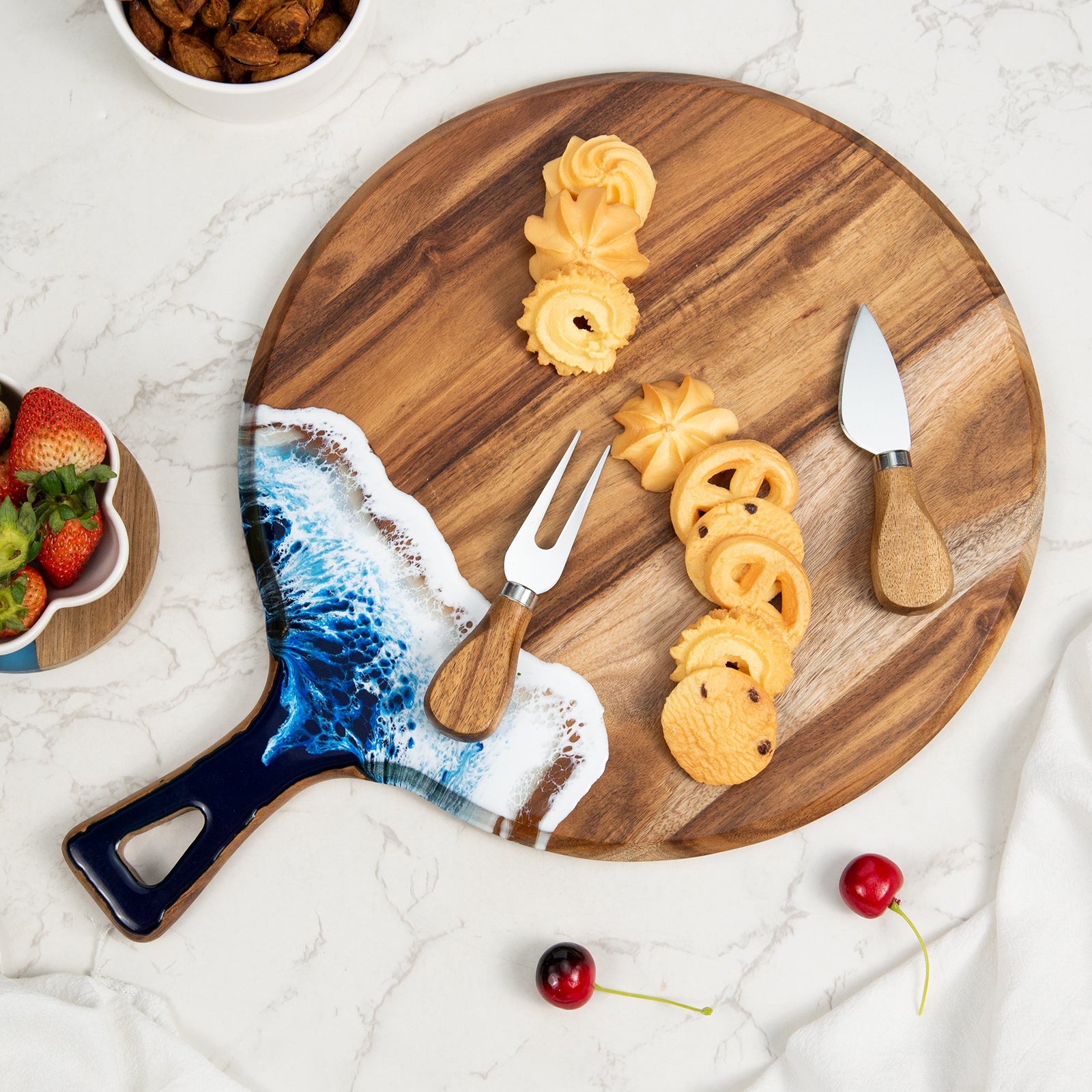 Round acacia wood and epoxy resin charcuterie board for cheese fruit desserts and ocean style serving