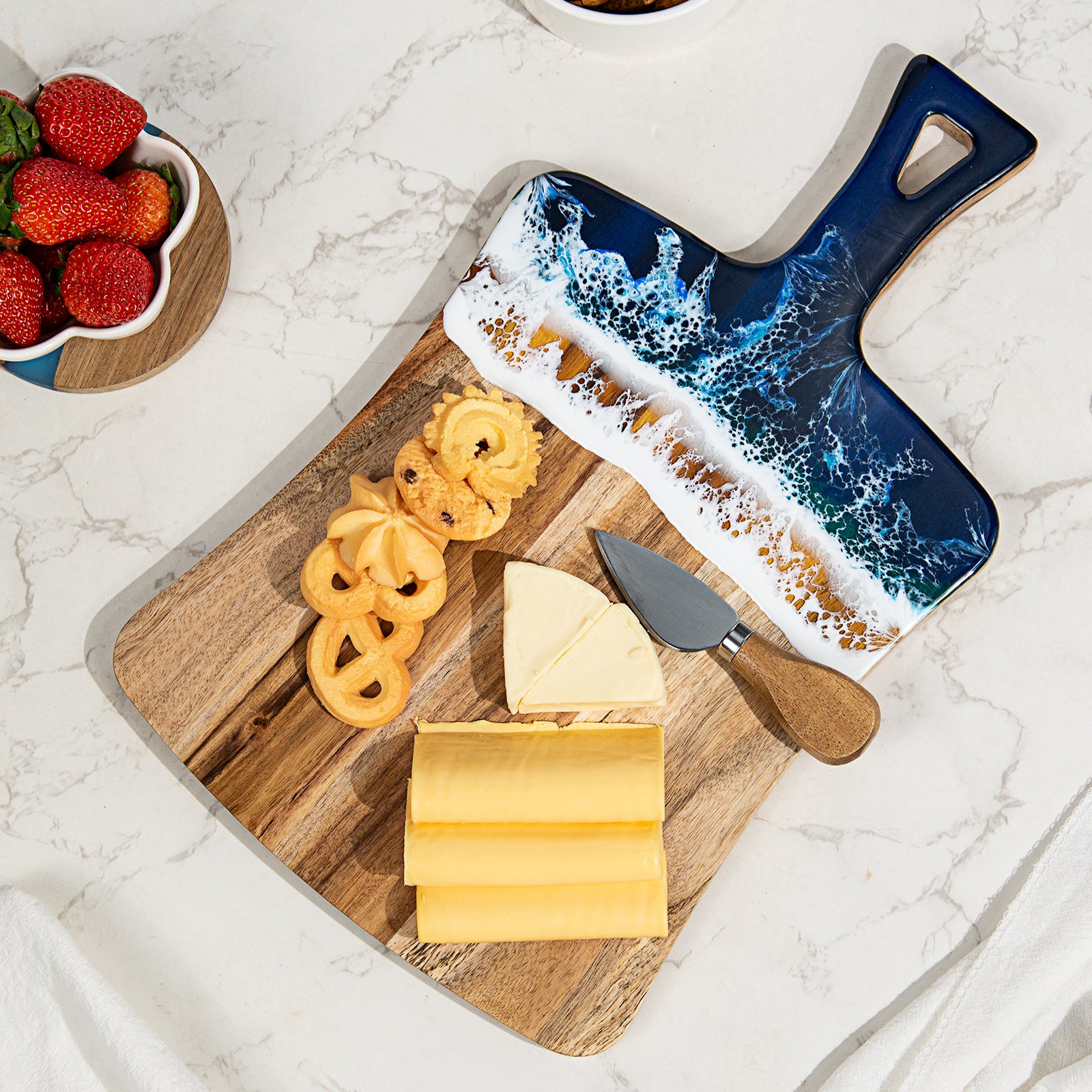 Acacia wood and epoxy resin charcuterie board with handle for cheese bread fruit and light prep