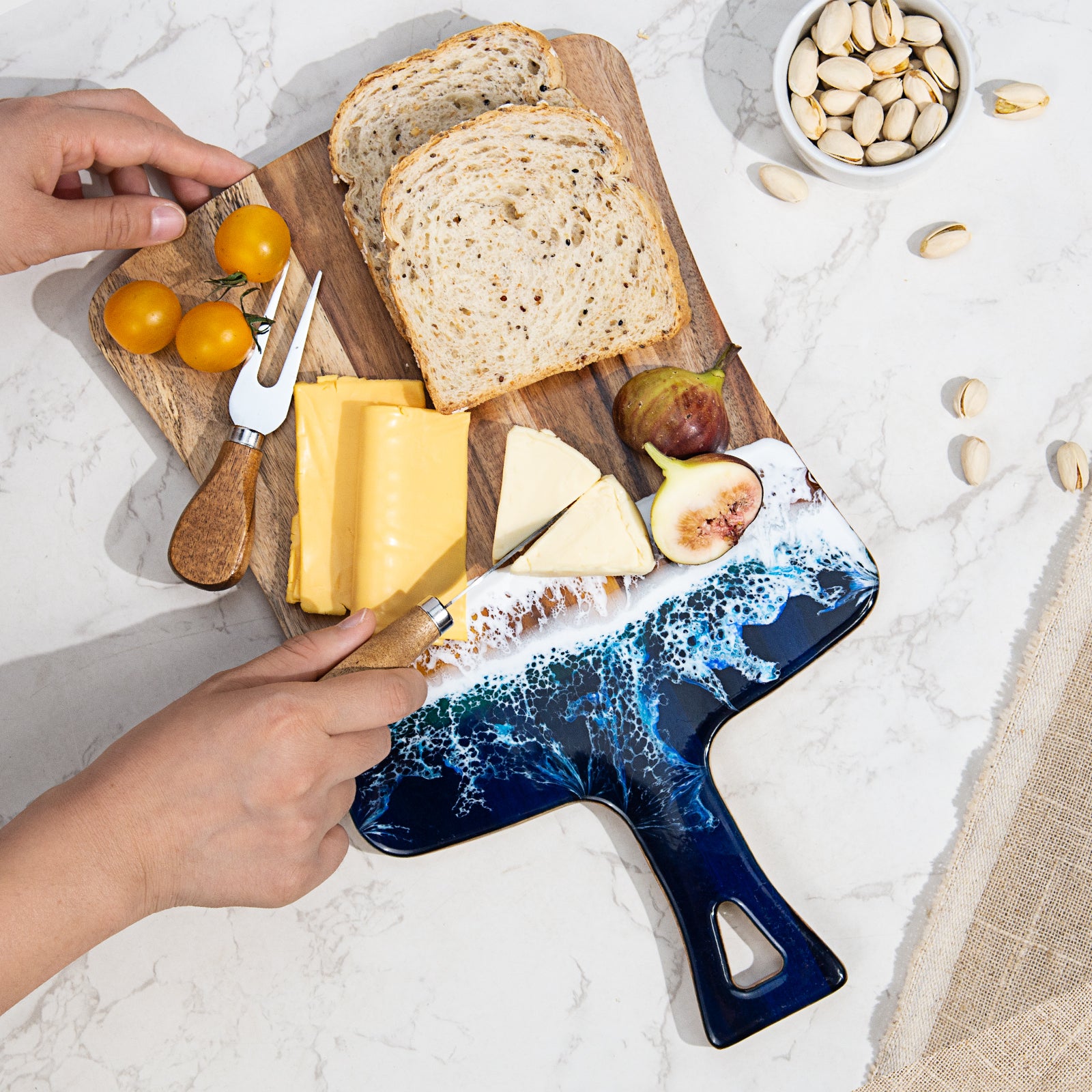 Acacia wood and epoxy resin charcuterie board with handle for cheese bread fruit and light prep