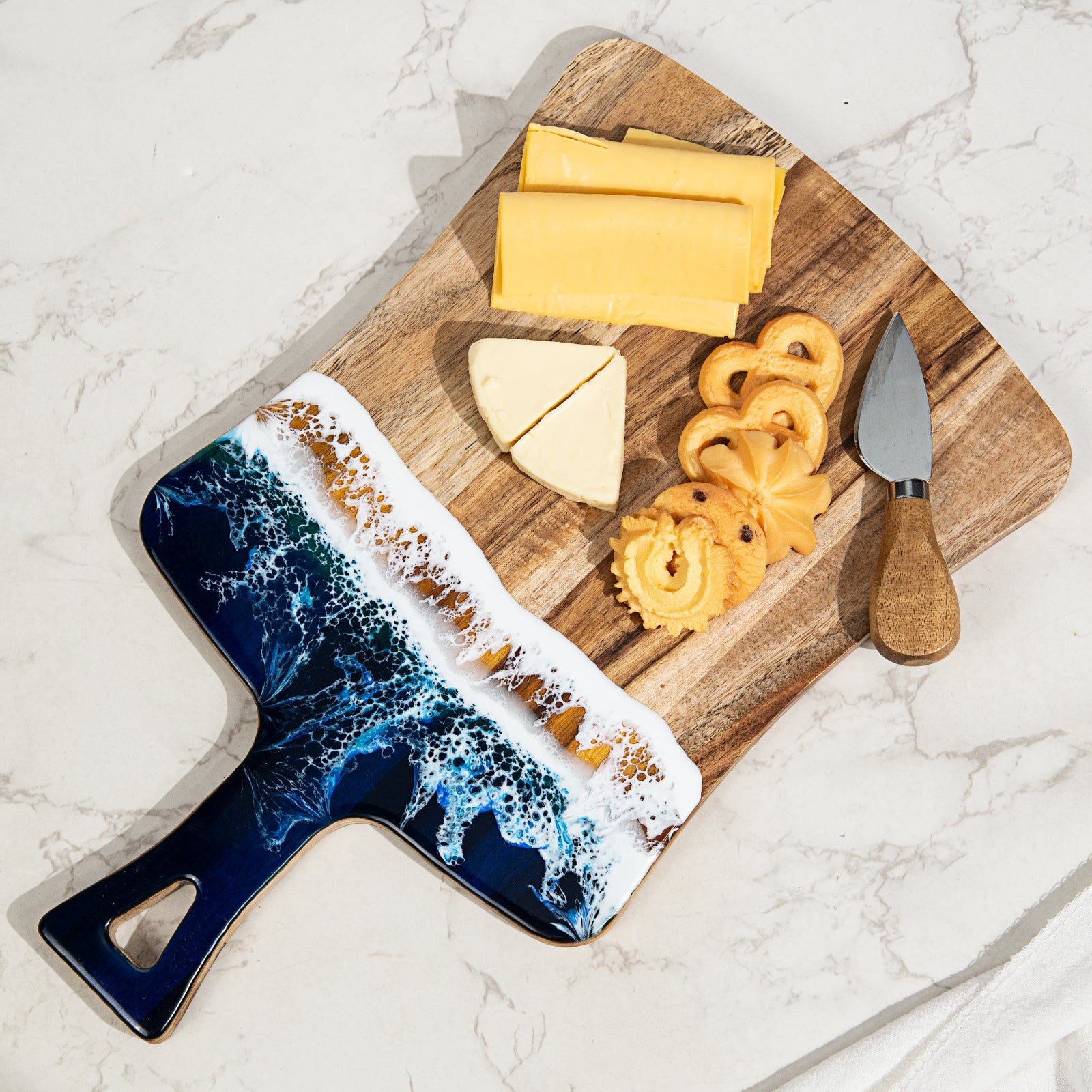 Acacia wood and epoxy resin charcuterie board with handle for cheese bread fruit and light prep