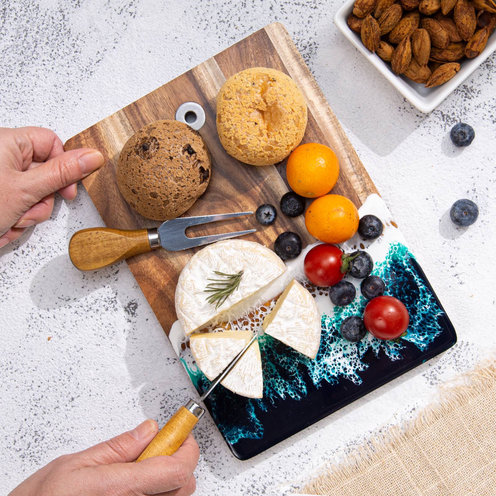 Small acacia wood and epoxy resin cheese board for fruit bread appetizers and compact serving