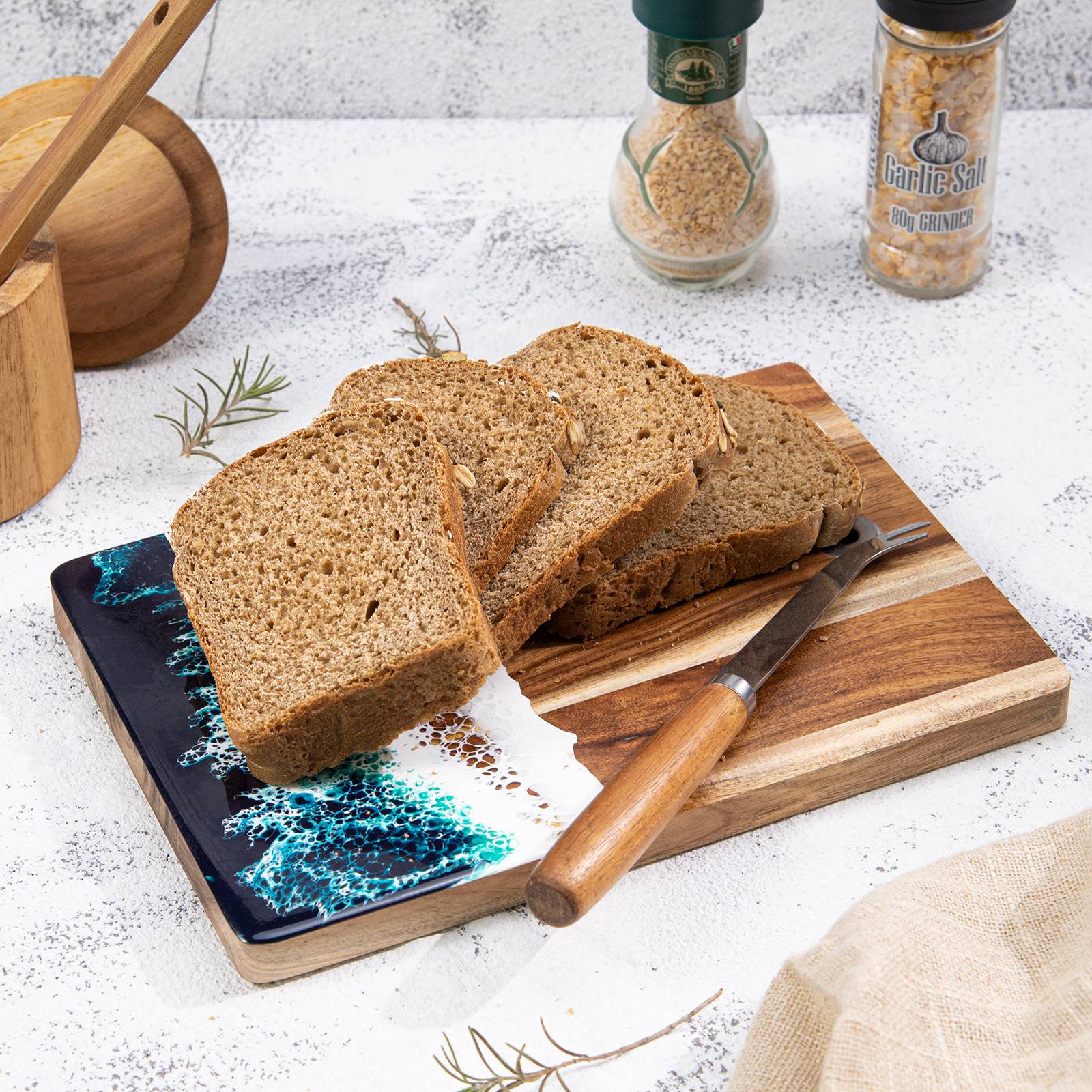 Small acacia wood and epoxy resin cheese board for fruit bread appetizers and compact serving