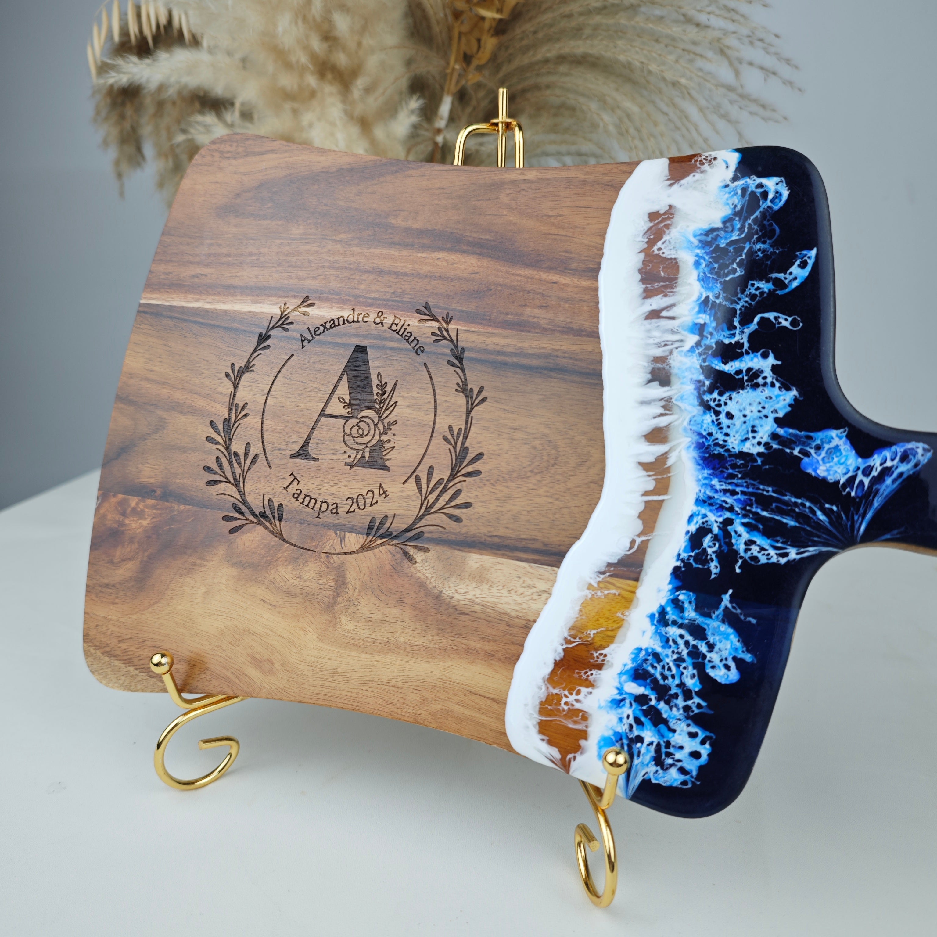 Handmade fan resin cutting board showing detailed engraving on acacia wood