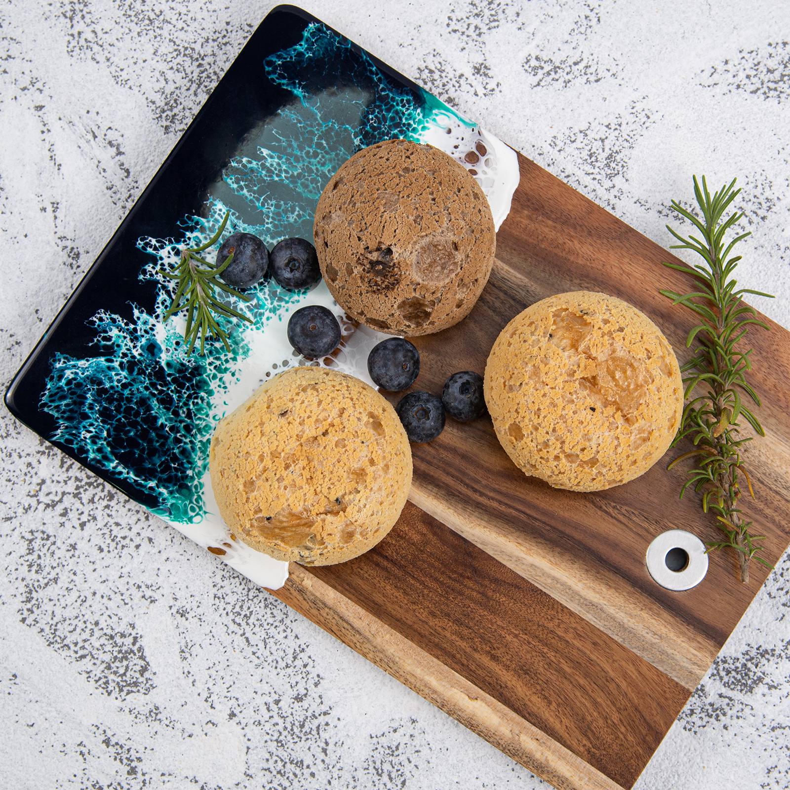Small acacia wood and epoxy resin cheese board for fruit bread appetizers and compact serving