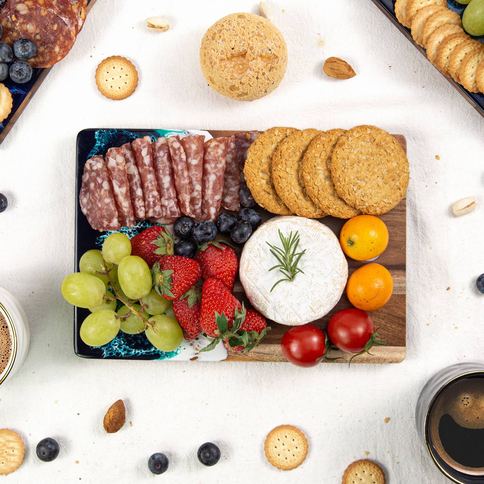 Small acacia wood and epoxy resin cheese board for fruit bread appetizers and compact serving