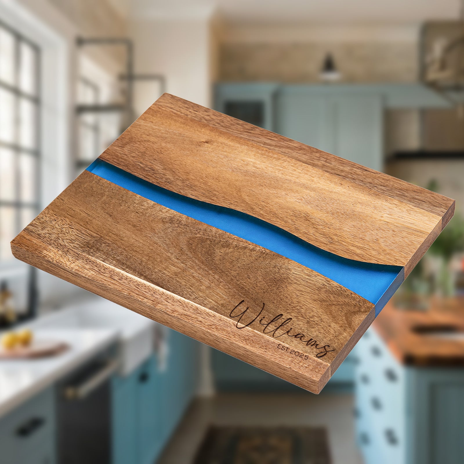 Personalized epoxy resin cutting board engraved with family name and established year on natural acacia wood with blue river inlay