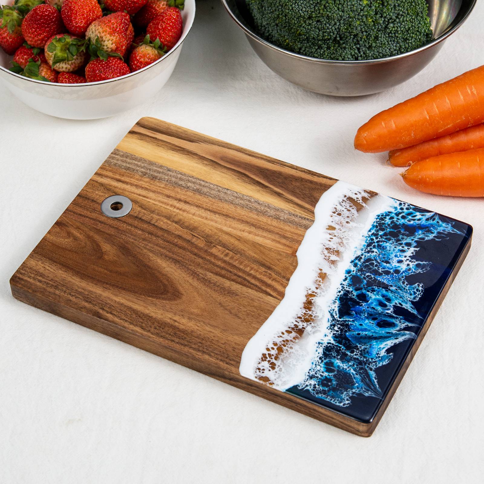 Small acacia wood and epoxy resin cheese board for fruit bread appetizers and compact serving
