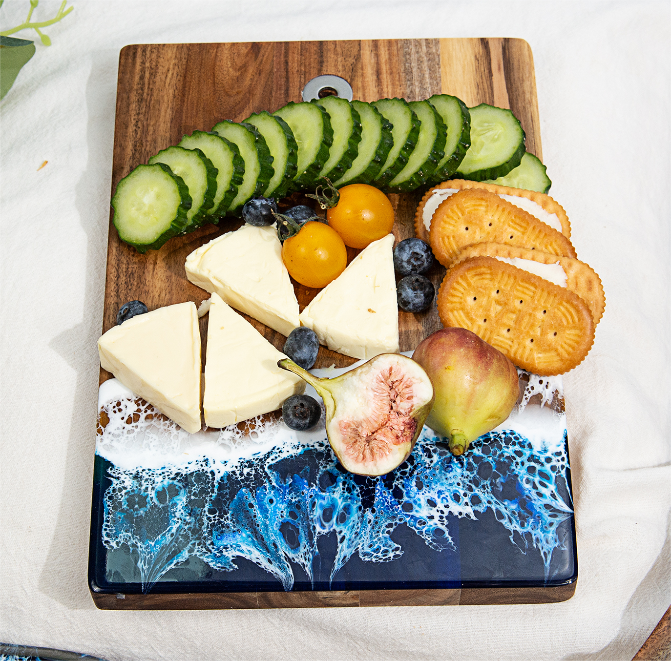 Small blue resin cutting board with special mom engraving as a unique Mother's Day gift
